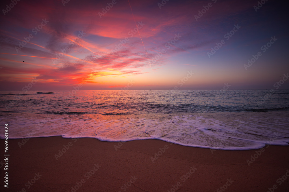 Beach sunrise over the tropical sea shore