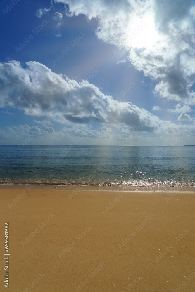 coastal island beach sandsky clouds and distant horizon