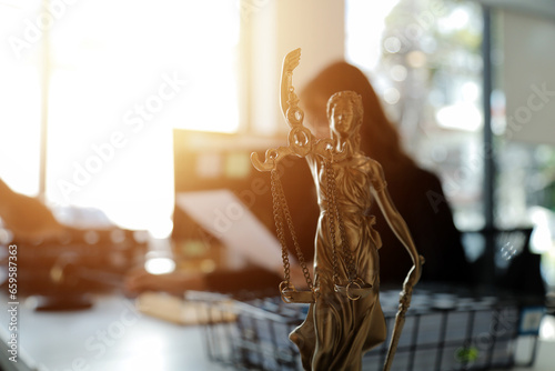 Fotografie Judge gavel with Justice lawyers having team meeting at law firm in background
