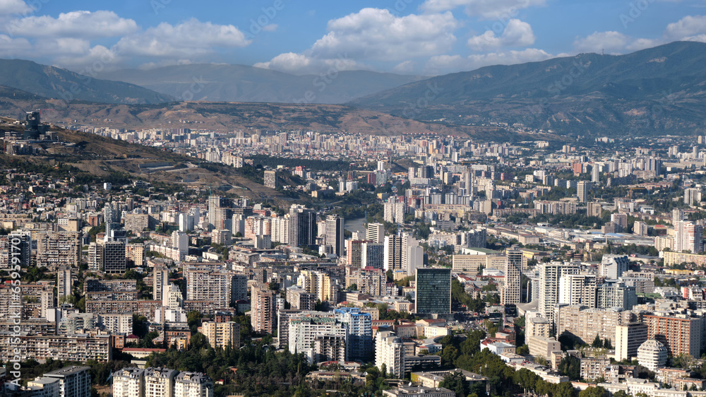 Aerial view of a large modern city with tall buildings