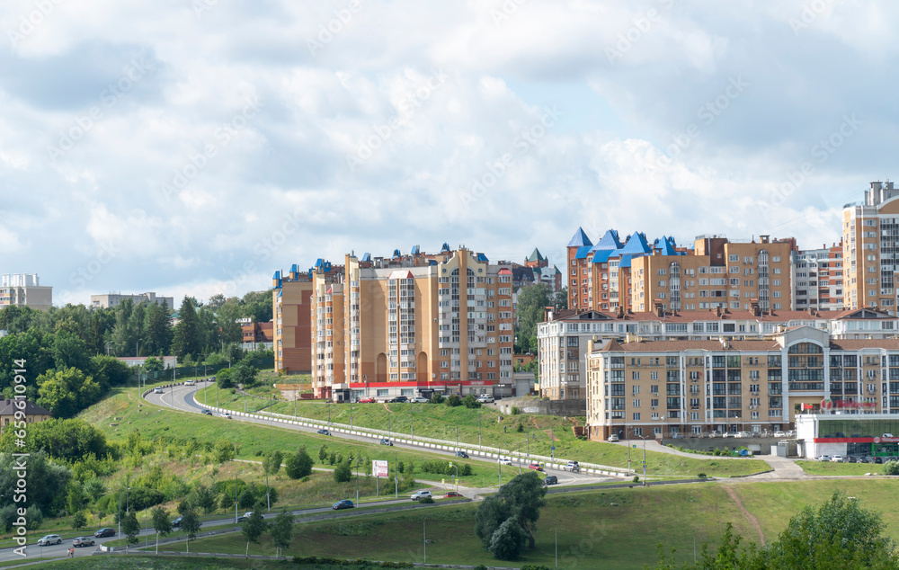 Fototapeta premium Cityscape of a modern residential area with apartment buildings, new green urban landscape in the city