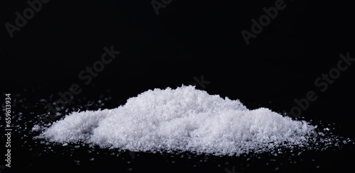 Pile of snow isolated on a black background. Heap of snow overlay for design.