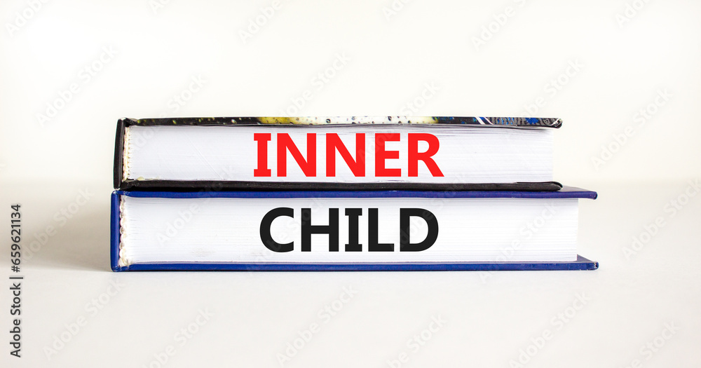 Inner child symbol. Concept words Inner child on beautiful books. Beautiful white table white background. Psychological, motivational inner child concept. Copy space.
