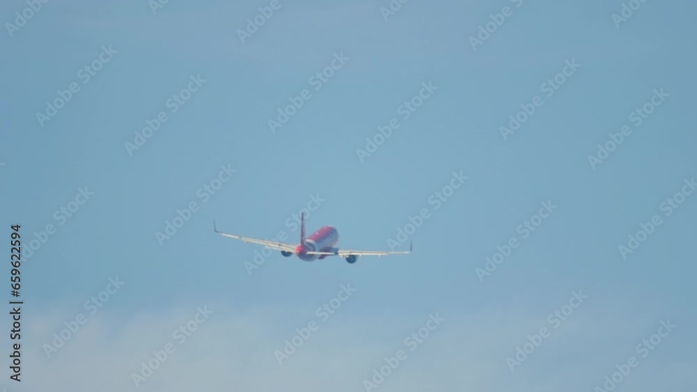 Airplane taking off and climbing at Phuket Airport, side view. Airplane flies in cloudy sky. Tourism and travel concept Airplane taking off and climbing at Phuket Airport, side view. Airplane flies in cloudy sky. Tourism and travel concept
