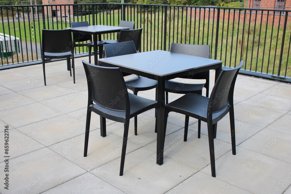 Outdoor seats and table, black plastic seats and table, outdoor seating area