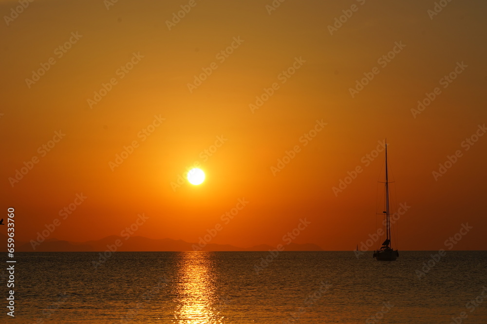 Boat at Sea During Sunrise