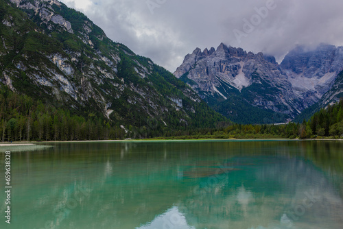 Fototapeta Naklejka Na Ścianę i Meble -  Lago di Braies, also known as Pragser Wildsee, is a breathtaking alpine lake nestled in the heart of the Dolomites, a UNESCO World Heritage site in northern Italy.