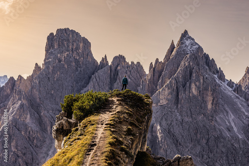 Here, on the mountaintop, he finds a sense of accomplishment, a connection to nature's grandeur, and a well-earned moment of solitude and reflection. photo
