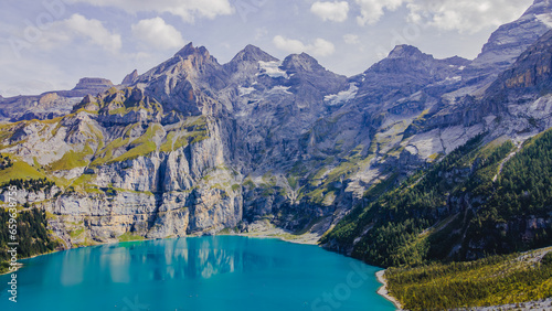 Oeschinensee, often referred to as Oeschinen Lake, is a picturesque alpine lake nestled in the Bernese Oberland region of Switzerland. 