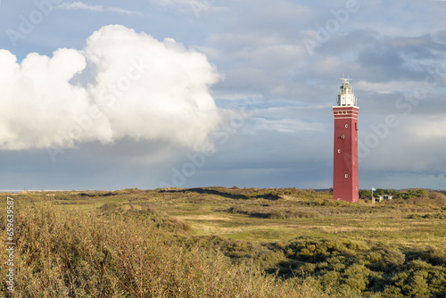 The red brick lighthouse Westhoofd situated in the dunes of Ouddorp at the North Sea coast in the Netherlands