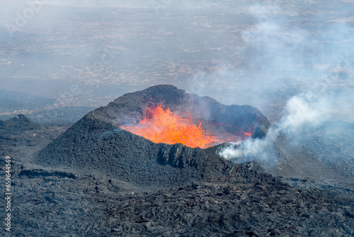 Close up view of spatter cone with lava of fissure near Litli-Hrútur Hill during the 2023 eruption near the mountain Fagradalsfjall, Iceland volcano area 