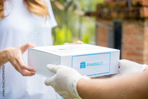 Photography Delivery man give medicine drug to patient female at home, Sick Asian young woma