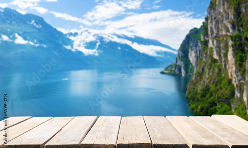 Empty wooden table and Summer view of lake Garda in Italy  Europe