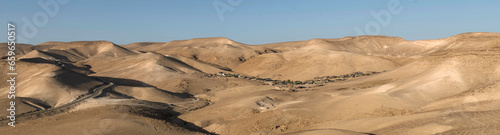 Tableau sur toile Negev desert panorama with a Bedouin settlement near the tourist resort Kfar Hanokdim between Arad and Masada in Israel