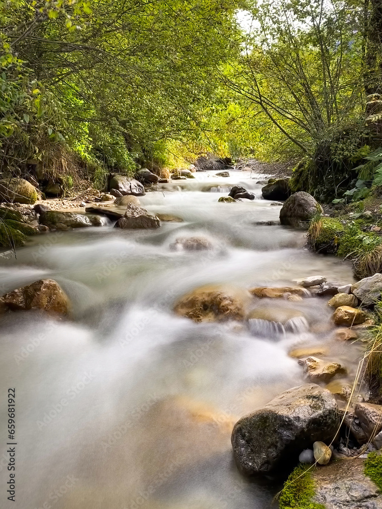 Obraz premium Long exposure of Rio di Funes Villnoesser Bach (engl. Villnoess creek) in South Tyrol, Italy