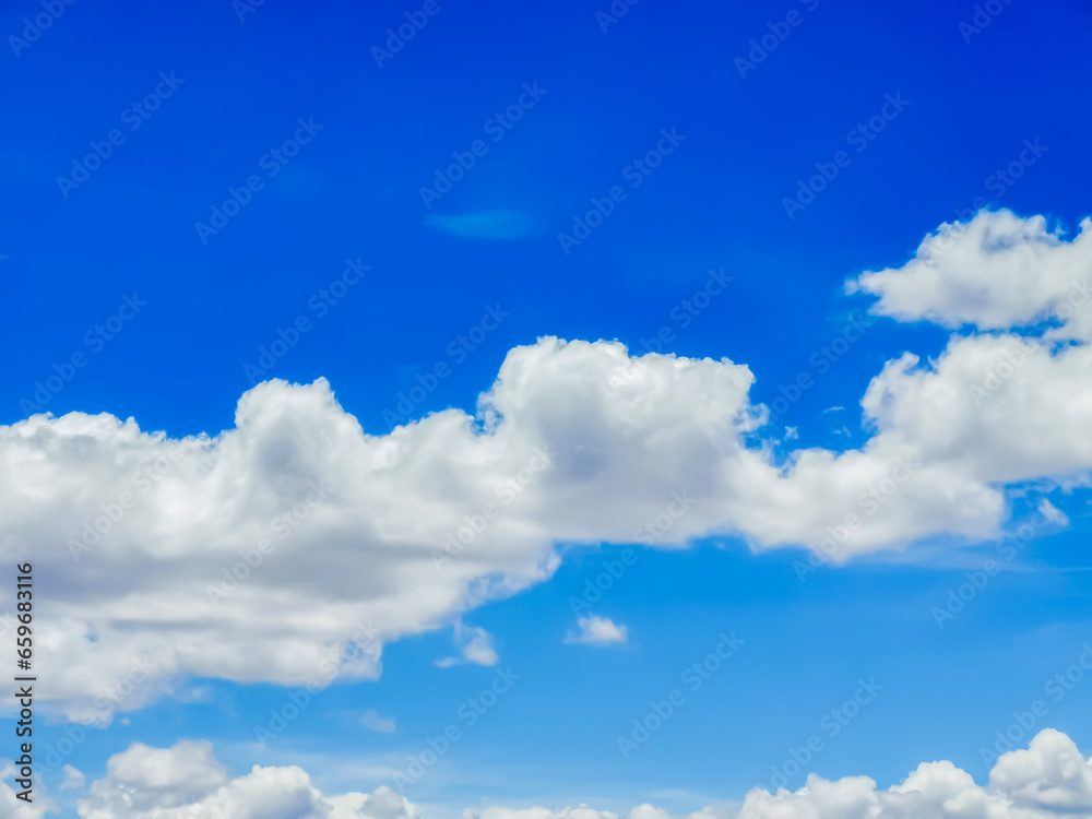 Fototapeta premium Sunny day with blue sky and some clouds, feeling of tranquility and relaxation