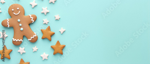 Gingerbread man and woman on a light blue background, top view. christmas, new year concept.