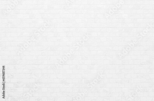 White grunge brick wall texture background for stone tile block in grey light color wallpaper interior and exterior and room backdrop design. Abstract white brick wall texture for pattern background. © Manitchaya