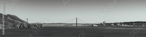 Photography Black and white panorama of the golden gate with downtown San Fransisco in the b