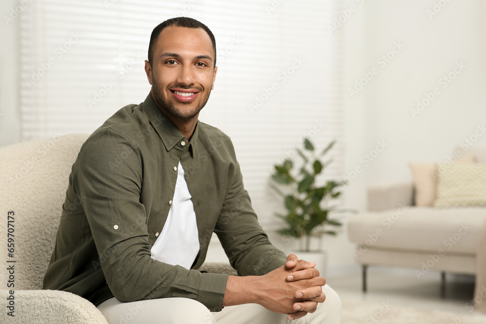 Portrait of handsome young man indoors, space for text Portrait of handsome young man indoors, space for text