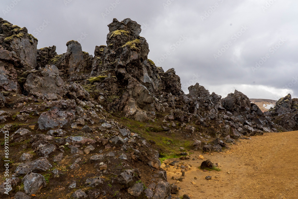 Laugarhaun lava field, hiking to the summer of Mt. Brennisteinsalda in Landmannalaugar, a location in Iceland's Fjallabak Nature Reserve in the Highlands.  