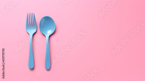 fork and spoon on pink background with copy space, Eating disorder awareness and recovery