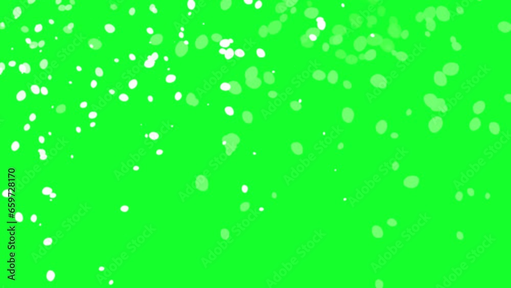 Snowflakes slowly falling down on a green background Snowflakes slowly falling down on a green background