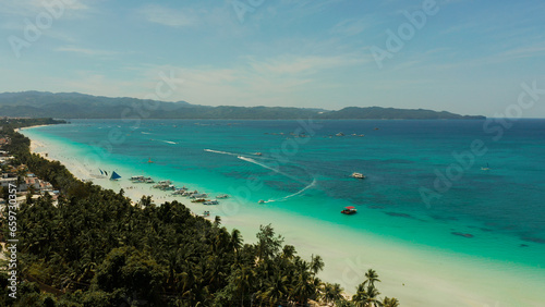 Tropical white sand beach, hotels near the blue lagoon and corall reef. aerial view, Boracay, Philippines. Seascape with beach on tropical island. Summer and travel vacation concept.