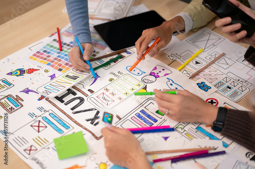 Close up view of young professional UX UI designer discussion on their project in the meeting room.