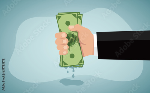 Economic shrink, Tight budget and recession shrinking economy. Pack of money dollar bills squeezed by hand.