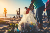 Group of eco volunteers picking up plastic trash on the beach - Activist people collecting garbage protecting the planet - Ocean pollution, environmental conservation and ecology concept