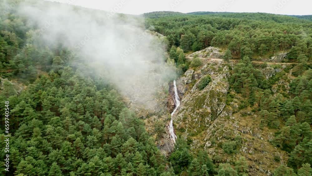 Fog over the forest where you can see a waterfall on the rock of the mountain, Guadarrama, Madrid, Fog over the forest where you can see a waterfall on the rock of the mountain, Guadarrama, Madrid,