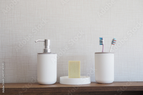 bathroom soap dispenser and toothbrush cup