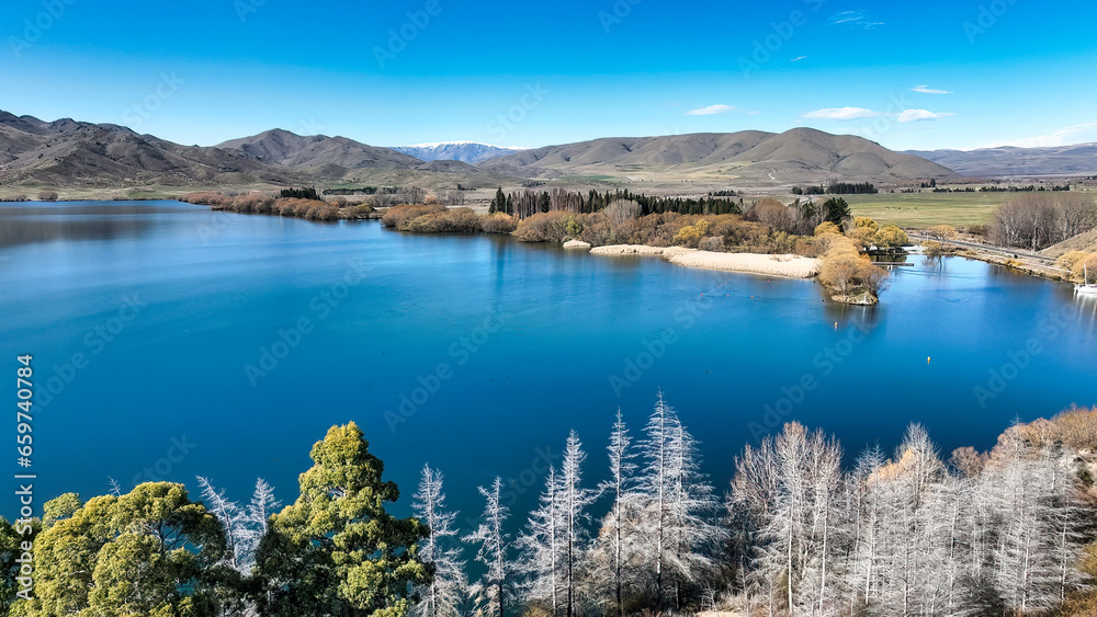 Obraz premium Aerial image of Benmore lake at Sailors cutting in the South Island of New Zealand