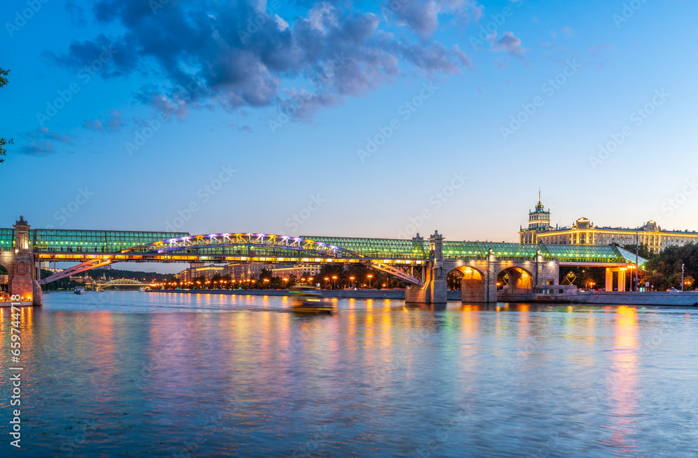 View of the Moscow river embakment, Pushkinsky bridge and cruise ships at sunset.