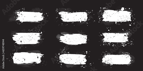 set of grunge paint stroke textures. white brush stroke  on black