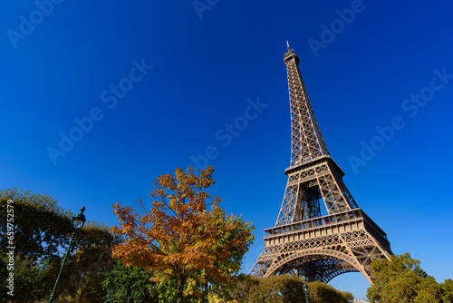 Eiffel Tower with sunny blue sky in Paris, France