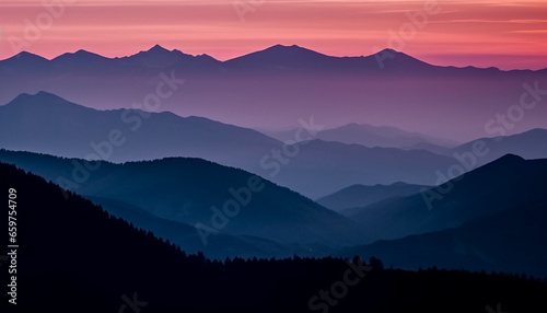 The majestic mountain range silhouetted against the tranquil sunset sky generated by AI © Jeronimo Ramos