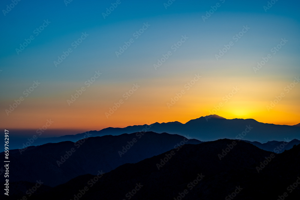 Sunset on the top of a hill on Joshua Tree National Park in California, United States