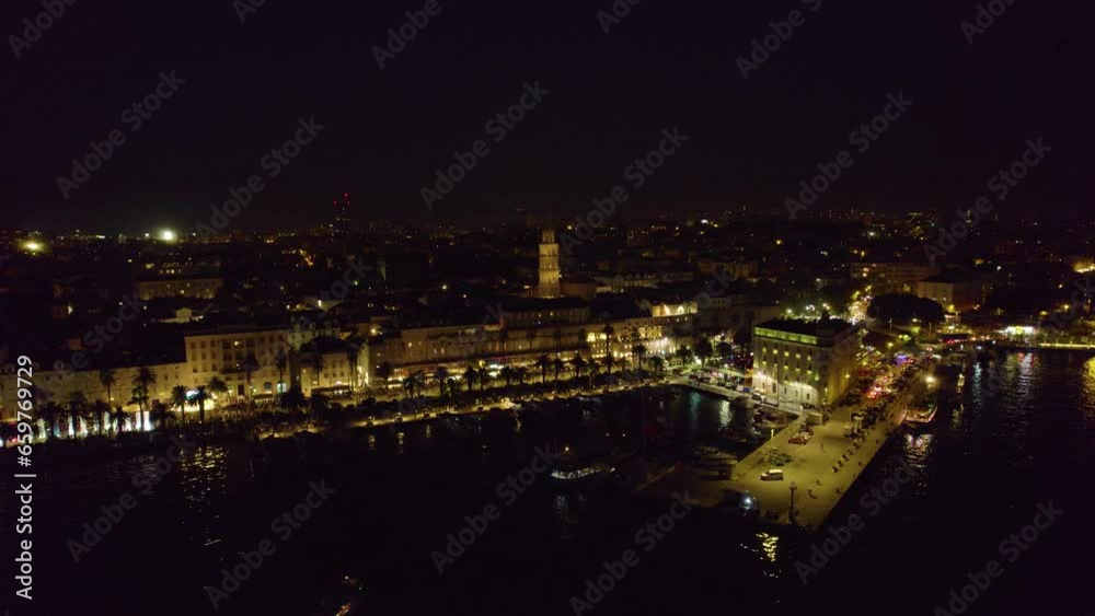 Aerial night view of Split, Croatia: city lights and sprawling urban tapestry Aerial night view of Split, Croatia: city lights and sprawling urban tapestry
