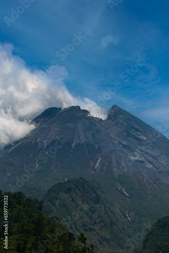Mount Merapi or Gunung Merapi is an active stratovolcano located on the border between Central Java and Yogyakarta provinces, Indonesian.