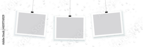 blank photo frames hanging on white background