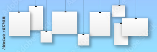 collection of hanging photos isolated on blue background