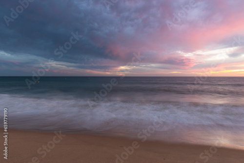 Fototapeta Naklejka Na Ścianę i Meble -  Sunset at sandy beach on Altantic Ocean coast in Portugal