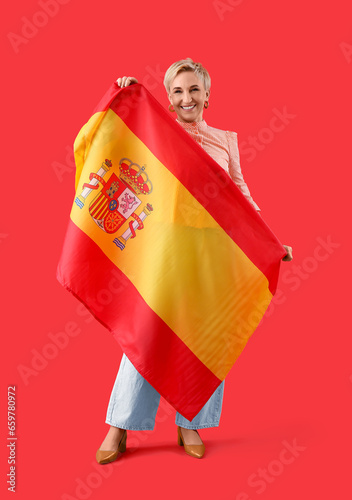 Happy mature woman with fla...