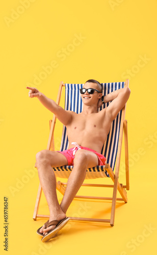 Teenage boy pointing at som...