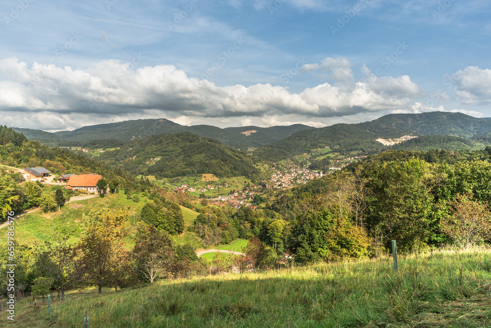 View of Ottenhoefen, a small village in the Achertal valley, in the background the Hornisgrinde, Black Forest, Baden-Wuerttemberg, Germany View of Ottenhoefen, a small village in the Achertal valley, in the background the Hornisgrinde, Black Forest, Baden-Wuerttemberg, Germany