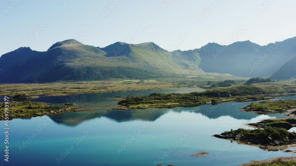Lake Mirroring The Graceful Form Of The Mountain Range