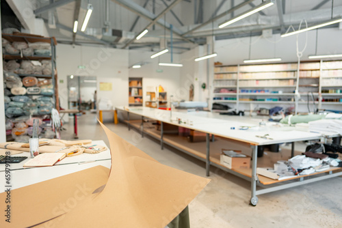 Interior of a sewing warehouse of furniture factory with equipment and materials photo