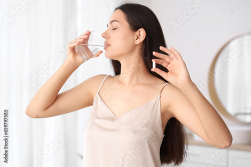 Young woman taking contrace...